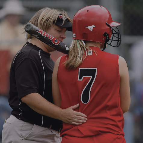 Picture of young baseball player being consoled.